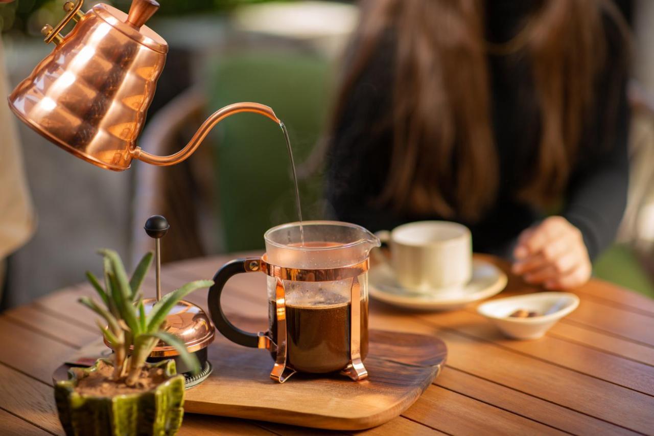 Hotel Jadali & Spa Marrakesh Exterior foto A copper kettle and a glass cup