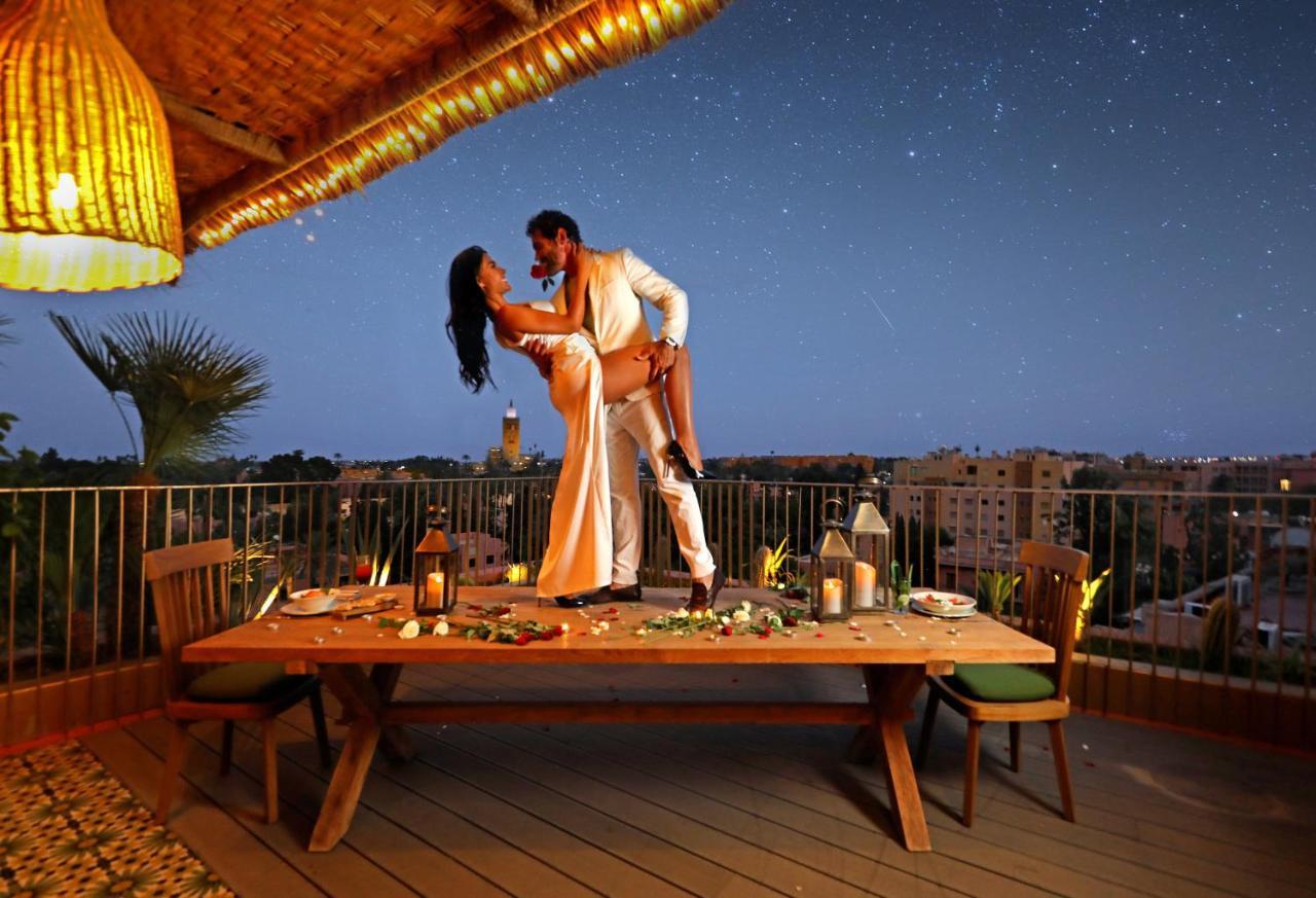 Hotel Jadali & Spa Marrakesh Exterior foto A couple dancing on a rooftop